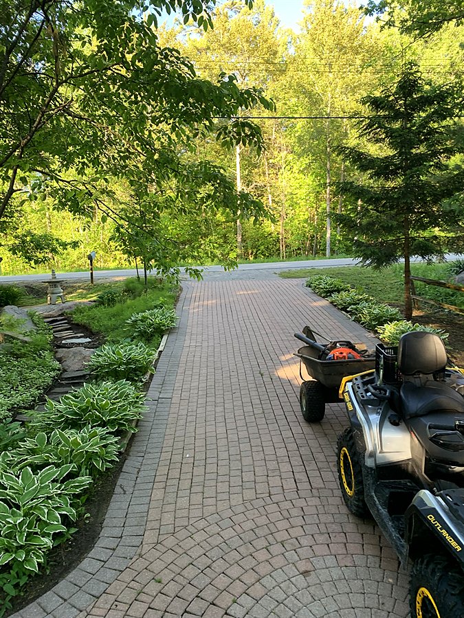 An ATV on the stone drive