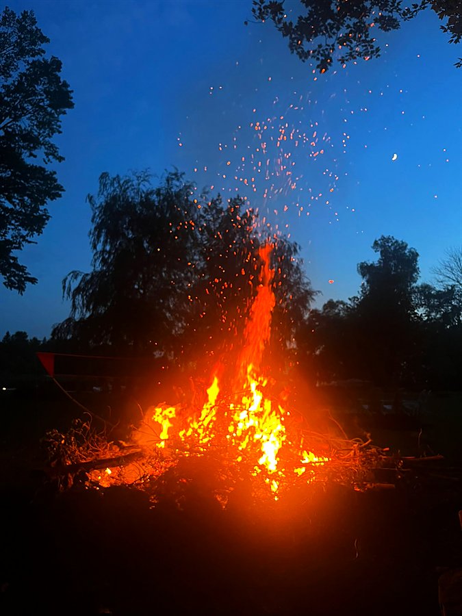 The bonfire blazing at night