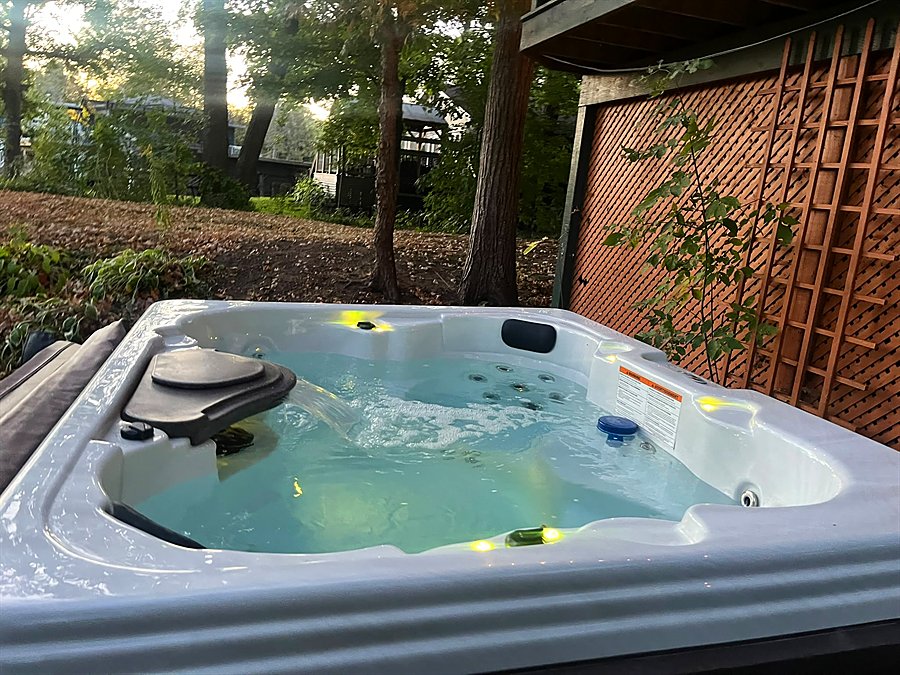 The hot tub lit up at dusk
