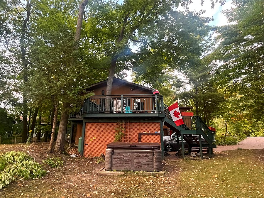 The back of the house and deck from the lawn