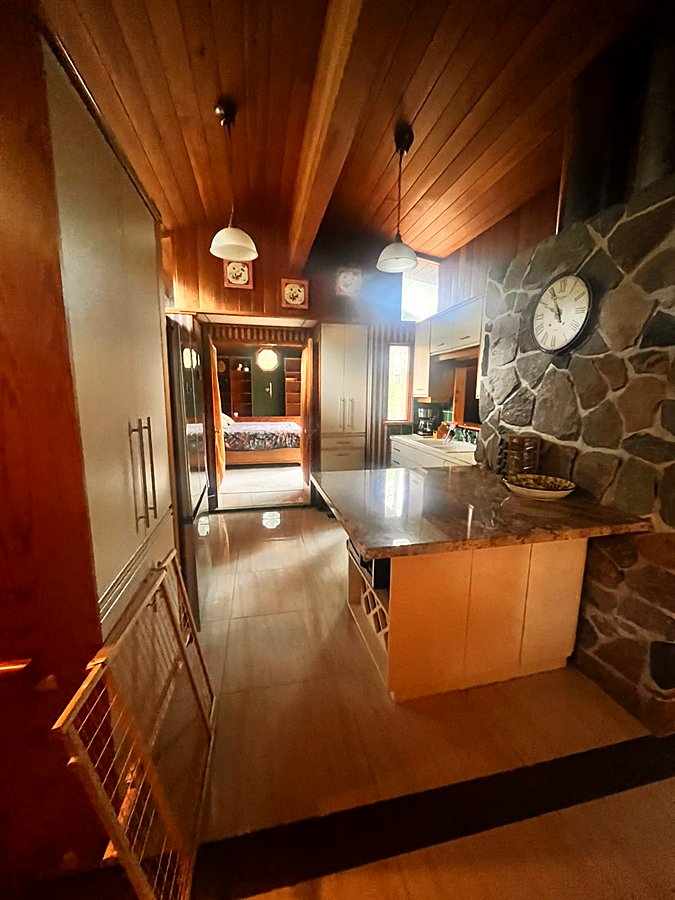 Breakfast counter beside the natural stone wall